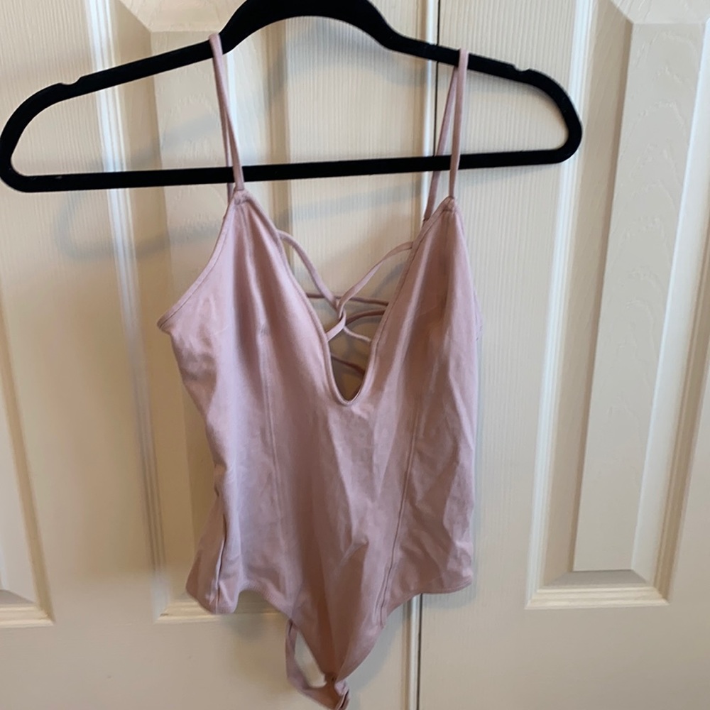 Light pink body suit